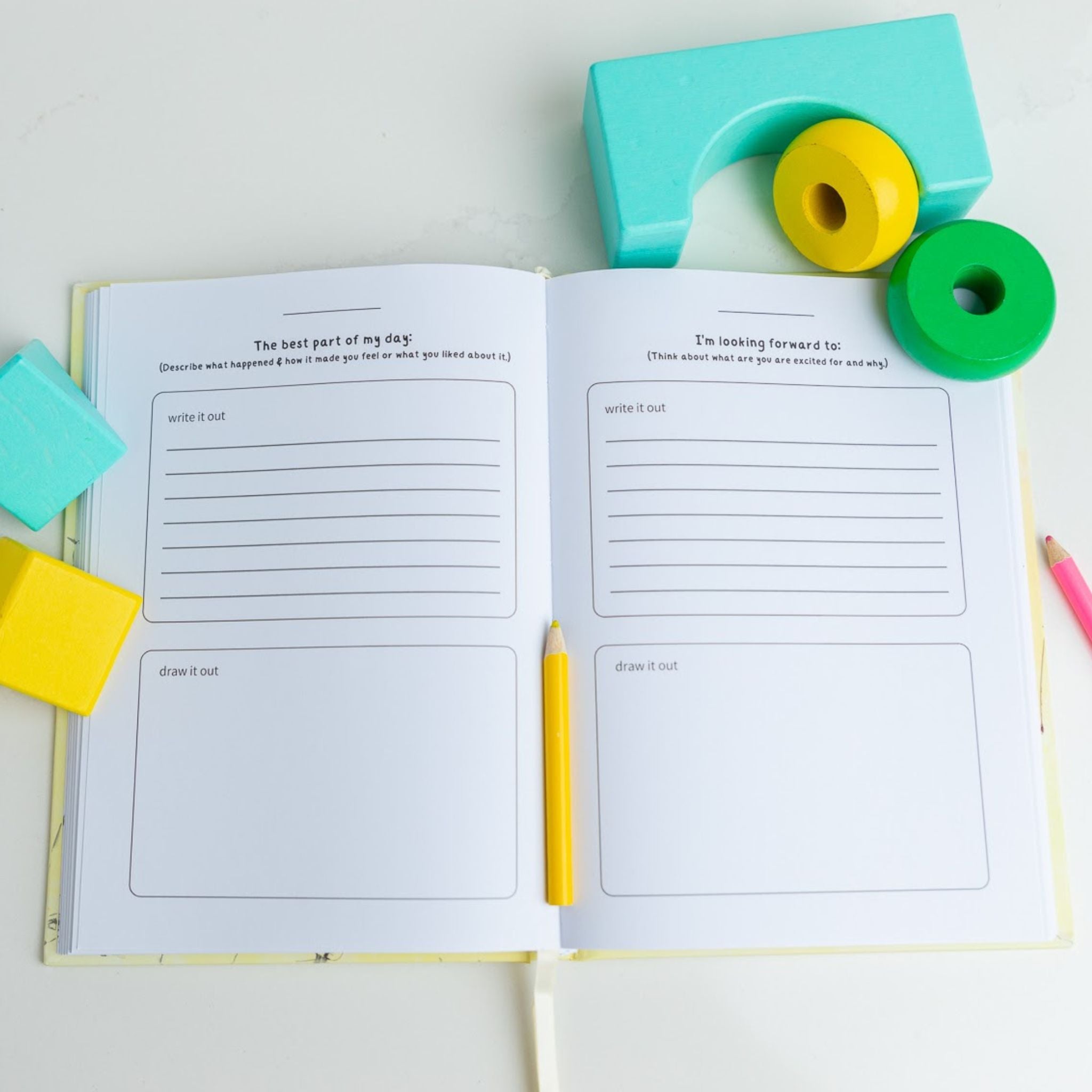 Inside pages of interactive family gratitude journal with prompts for all ages