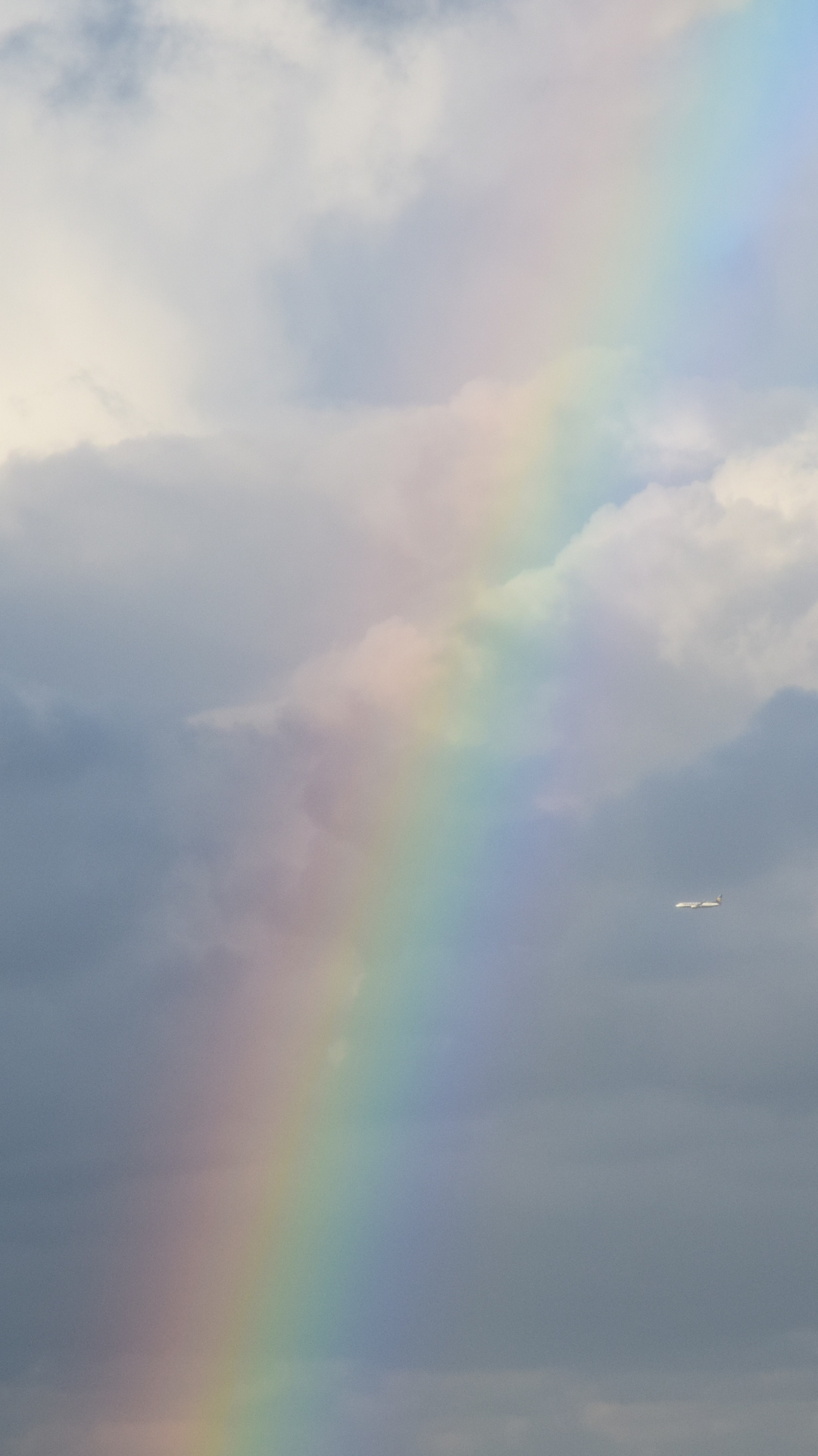 Rainbow against cloudy sky