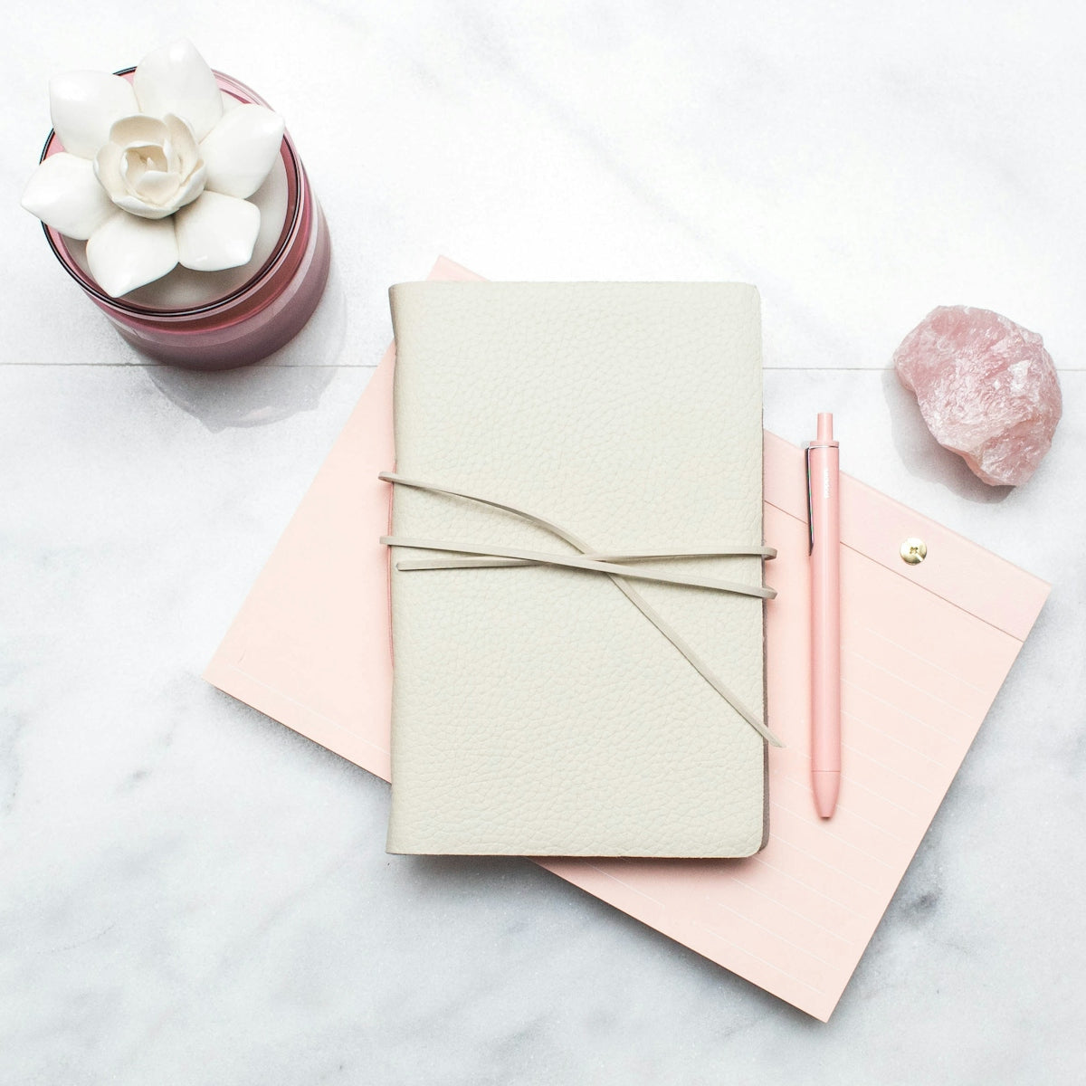 brown paper envelope with brown paper clip on white table