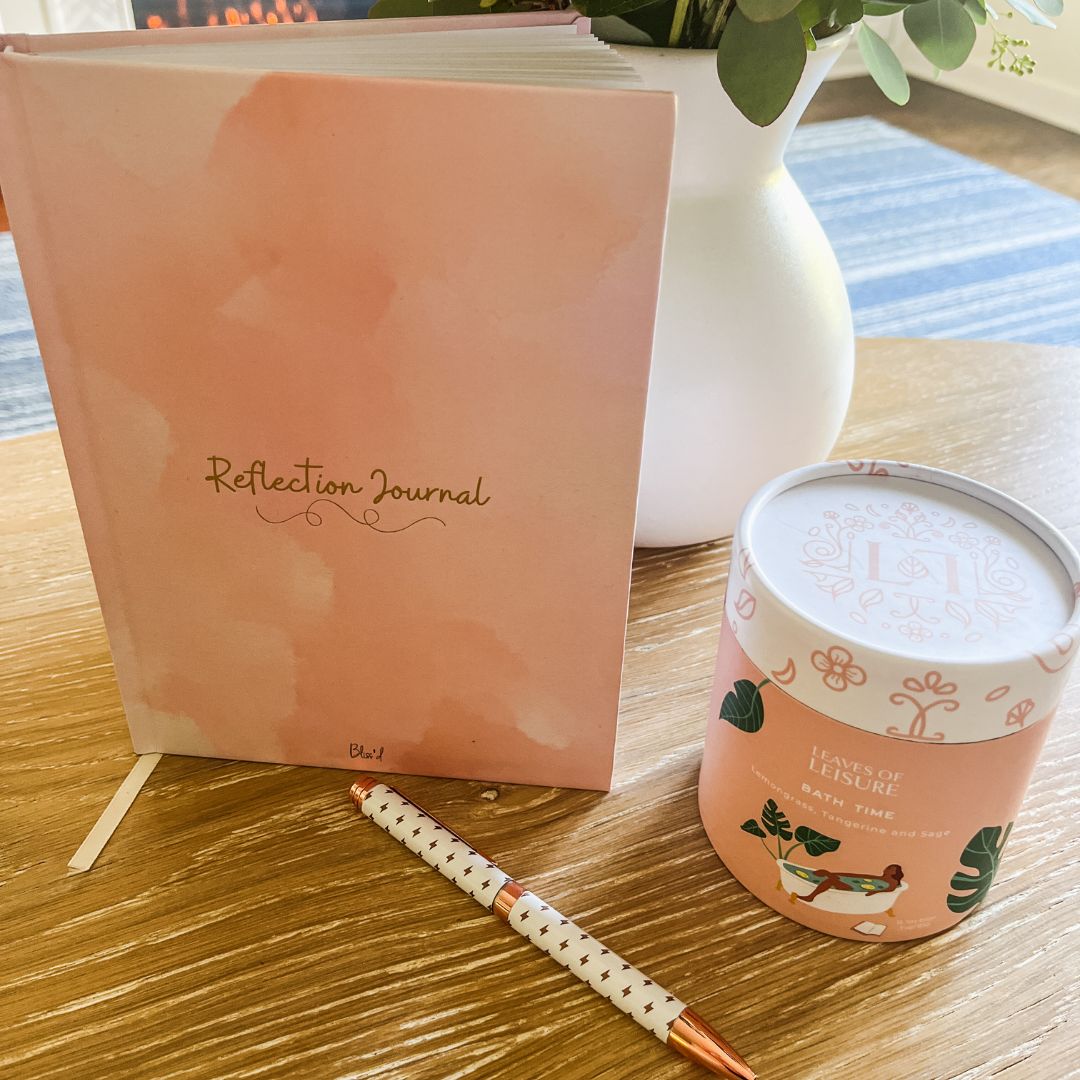 pink journal and winter tea bundle on table